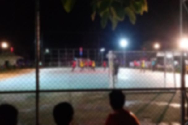 Floodlit multi-use games area at night