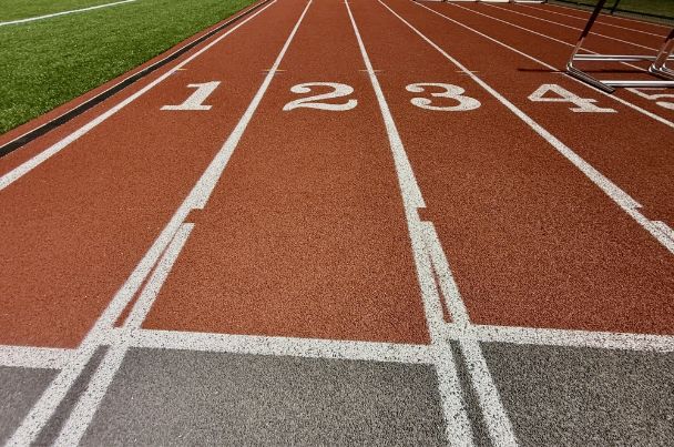 Floodlit athletics track at night