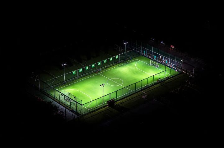 Floodlit soccer pitch at night